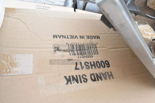 Cardboard box labeled "Hand Sink" model 600SW60, showing minor scratches and dents, made in Vietnam.