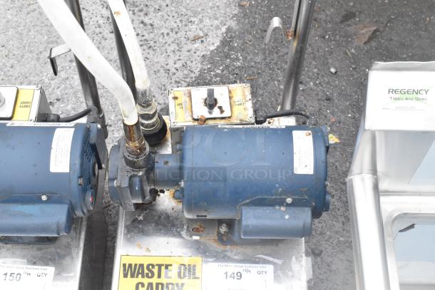 Frontline 10SS stainless steel commercial oil filtration system on casters, visible wear, includes waste oil caddy label.