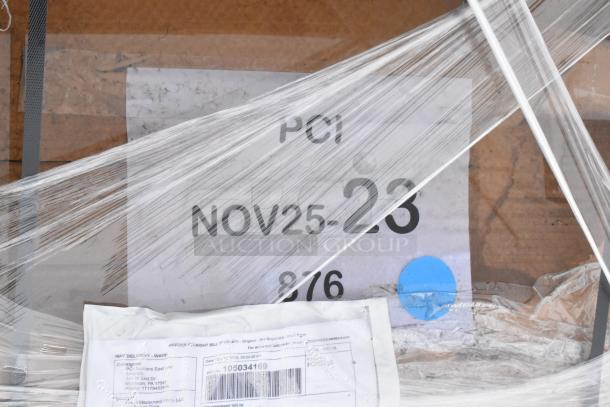 Box marked "NOV25-23" wrapped in plastic, labeled for PCI Auctions with shipping details visible.
