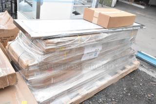 10 brand new scratch and dent items, including work table, wire shelf, and broiler stand, wrapped on pallet with labels.