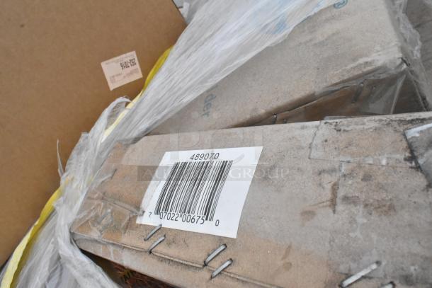 Stack of boxed items labeled with barcode 489070, wrapped in plastic. Contains Quantum Wire Shelves, Nexel Document Holder.