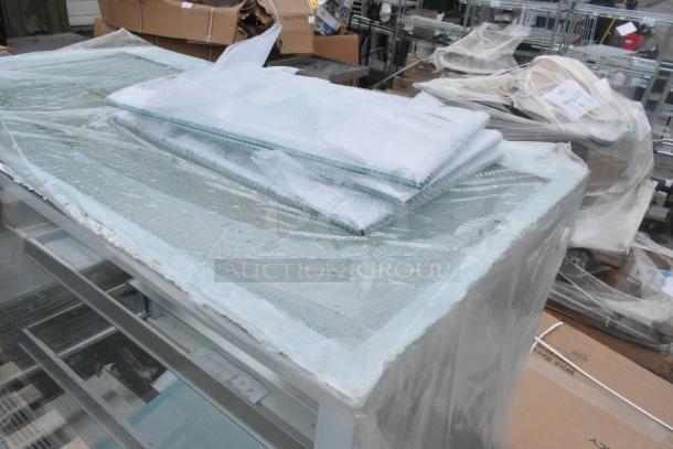 Brand new Avantco 193BCF48W metal bakery display case, white, broken glass visible, refrigerated, 110-120V, 1 phase.