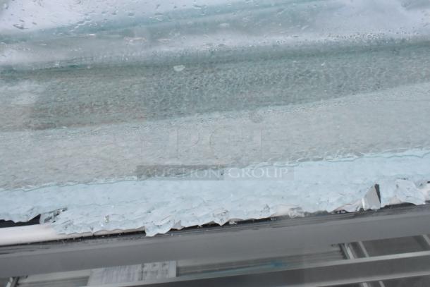 Brand new Avantco 193BCF48W commercial bakery display case with broken glass. White metal, 110-120 volts, 1 phase.