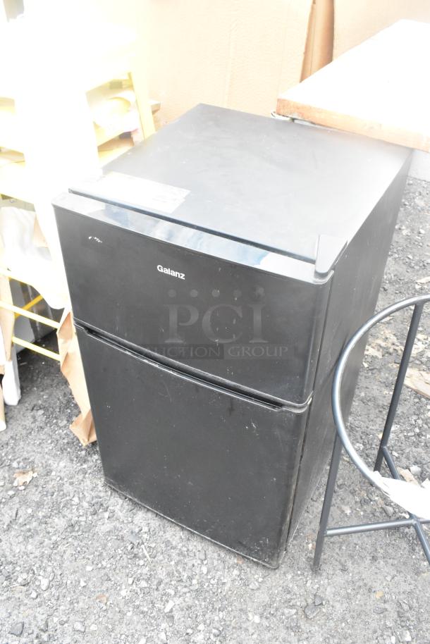 Galanz GL31BK Mini Cooler w/ Freezer, 115V, 1 Phase, black finish, visible wear, suitable for compact spaces.