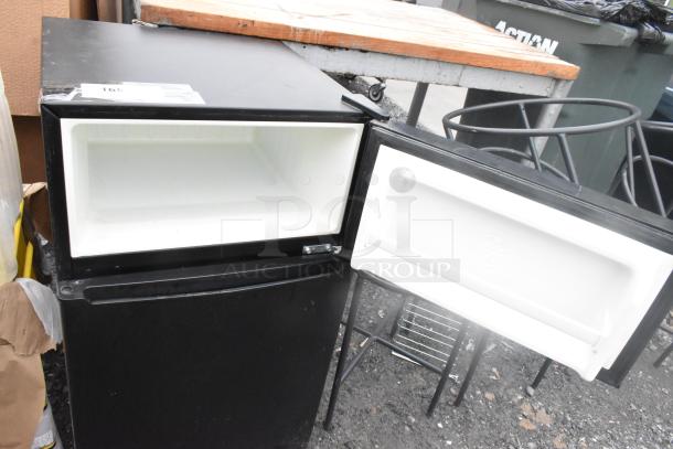 Galanz GL31BK Mini Cooler w/ Freezer, black, 115 volts, 1 phase, in good condition, open doors showing interior space.