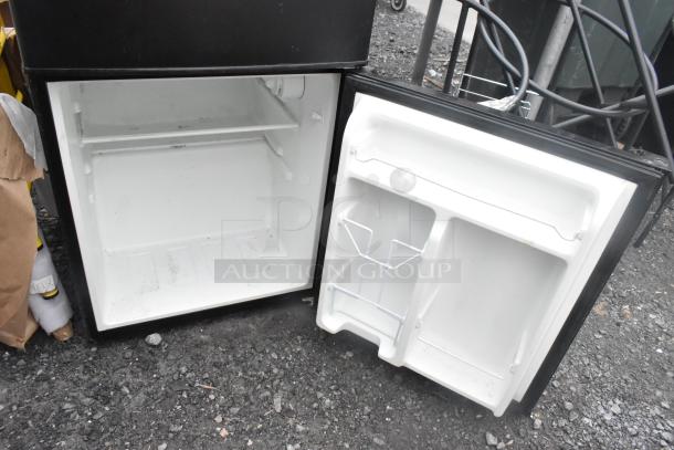 Galanz GL31BK Mini Cooler with Freezer, black, 115 volts, 1 phase, open showing interior shelves and door storage.