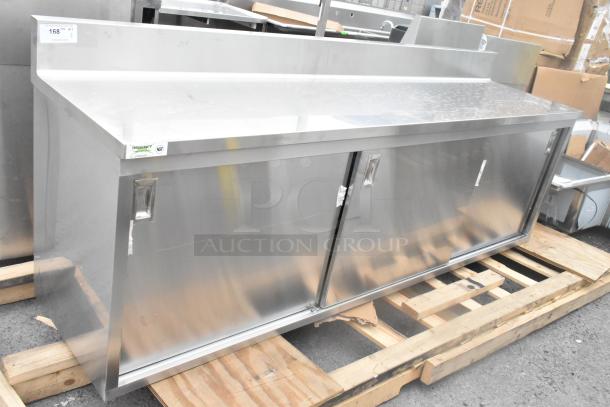 Brand new Regency 600EBTB2496D 24"x96" stainless steel enclosed table, sliding doors, adjustable midshelf, 6" backsplash.