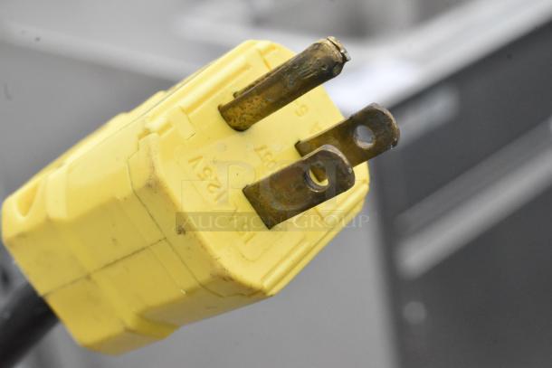 Yellow 15A 125V electrical plug close-up for the QualServ stainless steel commercial portable sink.