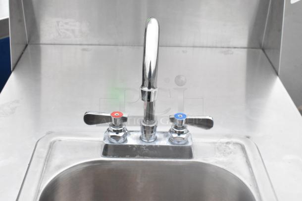 QualServ stainless steel single bay portable sink, polished finish, with hot and cold taps, on commercial casters.