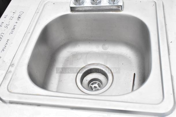QualServ stainless steel single bay portable sink on casters, showing basin and faucet. Used condition with visible markings.