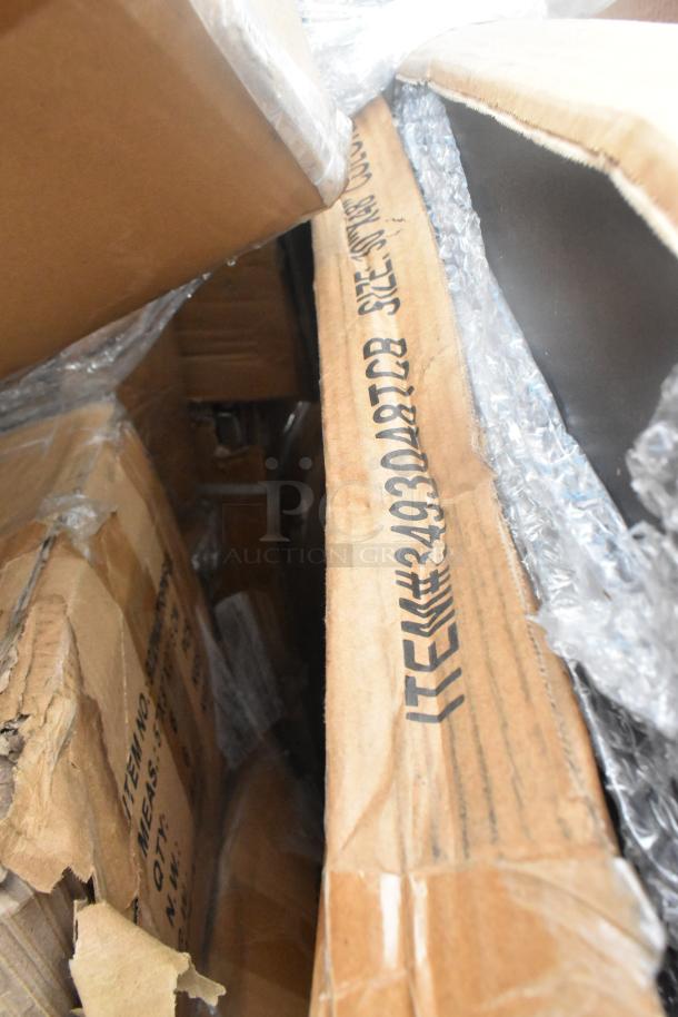 13 brand new scratch and dent items in boxes, including Acopa chafer cover and Lancaster table top. Visible item codes on packaging.