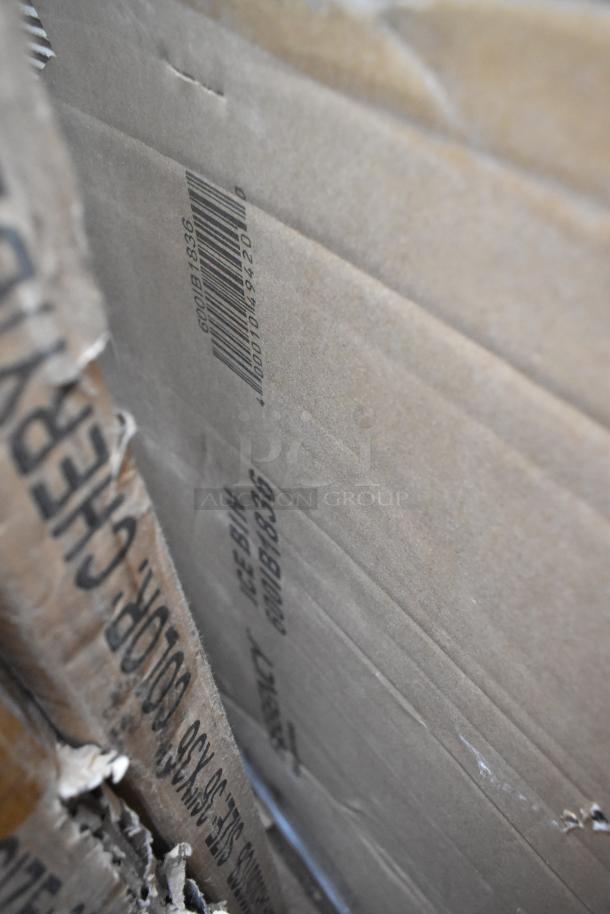 Cardboard boxes with visible barcode and text, indicating a lot of 13 brand new scratch and dent items for auction.