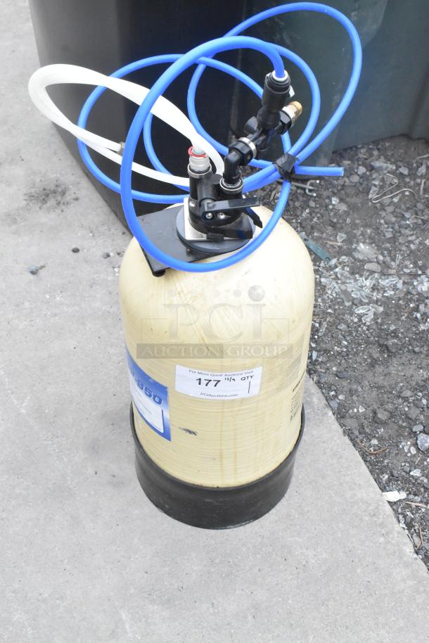 Everpure ESP-950 Tank with blue tubing, item tag visible, in used condition, suitable for filtration systems.