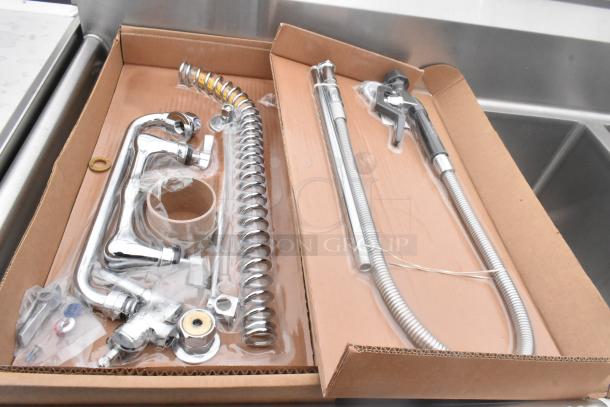 Stainless steel 3 bay sink with dual drain boards and under shelf. New, includes parts and fittings in packaging.