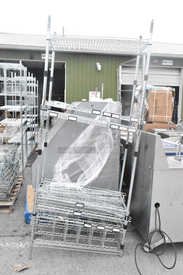 Chrome finish shelving unit, dismantled for auction. Buyer must dismantle for shipping. Consider freight charges.