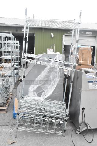 Chrome finish shelving unit, dismantled for auction. Buyer must dismantle for shipping. Consider freight charges.