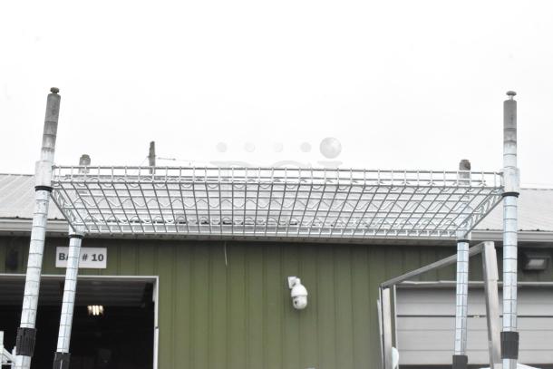 Chrome finish shelving unit, wire shelves, sturdy metal frame, buyer dismantles, ideal for storage, check freight costs.