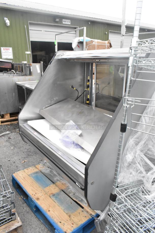 Metal Commercial Reach In Grab N Go Merchandiser, in good condition, placed on a pallet. Suitable for retail use.