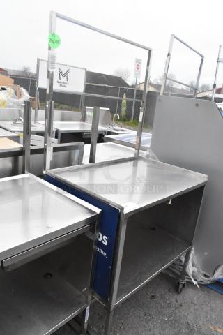 Stainless steel table with under shelf on commercial casters, good condition, Member's Mark branding visible.