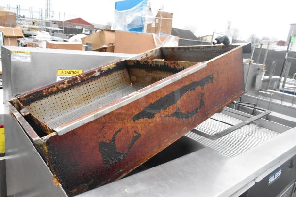 Giles EOF-24 commercial fryer with 3 bays, dumping station, on casters. Visible labels, worn condition, 480V, 3-phase.