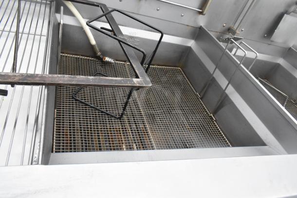 Giles EOF-24 stainless steel 3 bay deep fat fryer with dumping station, electric, 480V, 3 phase, on commercial casters.