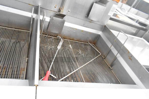Giles EOF-24 stainless steel 3-bay deep fat fryer with dumping station, commercial casters, used condition.