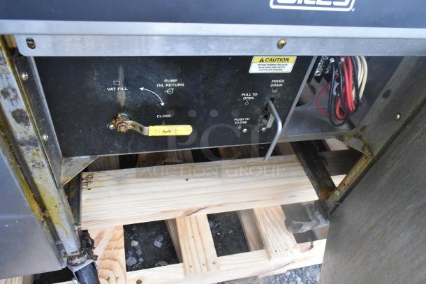 Giles EOF-24 stainless steel 3-bay electric fryer with dumping station. Features power controls and caution labels. 480V, 3-phase.