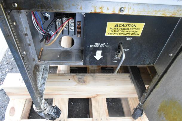 Giles EOF-24 Stainless Steel 3 Bay Deep Fat Fryer on commercial casters. Features 480V, 3-phase power, dumping station.