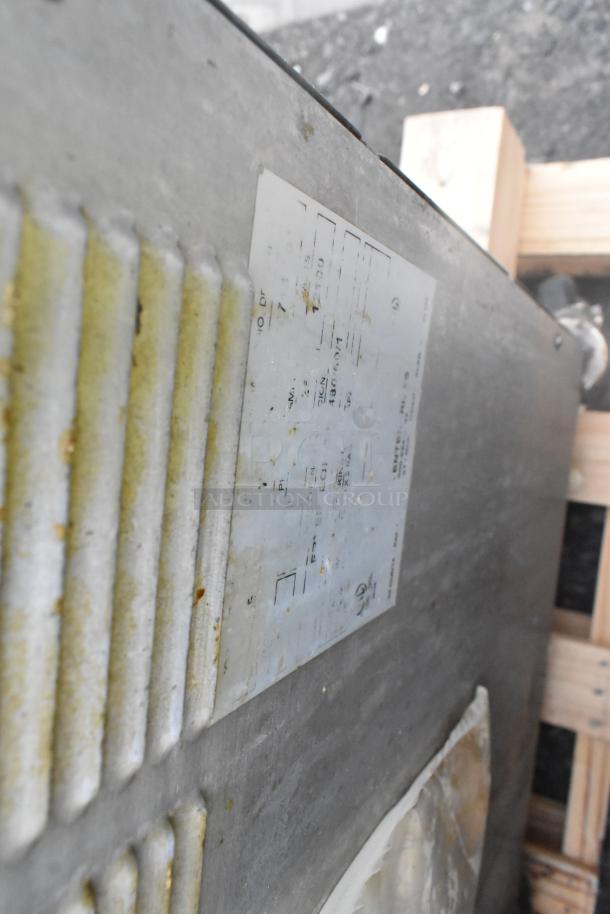 Giles EOF-24 stainless steel deep fat fryer label. Shows model specs: 480 volts, 3 phase, 3 bay, on commercial casters.