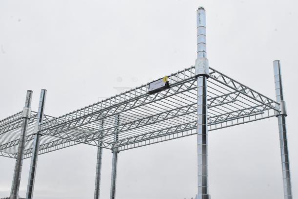 Chrome finish 7 tier wire shelving unit in excellent condition. Features sturdy construction with adjustable shelves. Visible label indicates load limits. Buyer must dismantle for shipping.