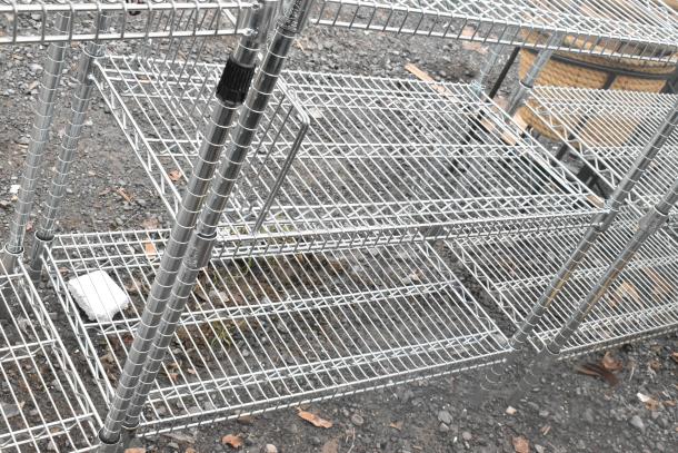 Chrome finish 4-tier wire shelving unit, in good condition, with adjustable shelves. Buyer dismantles for shipping.