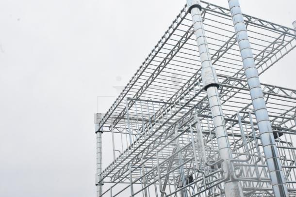 Chrome finish 7 tier wire shelving unit in excellent condition. Sturdy metal design with visible support markings.