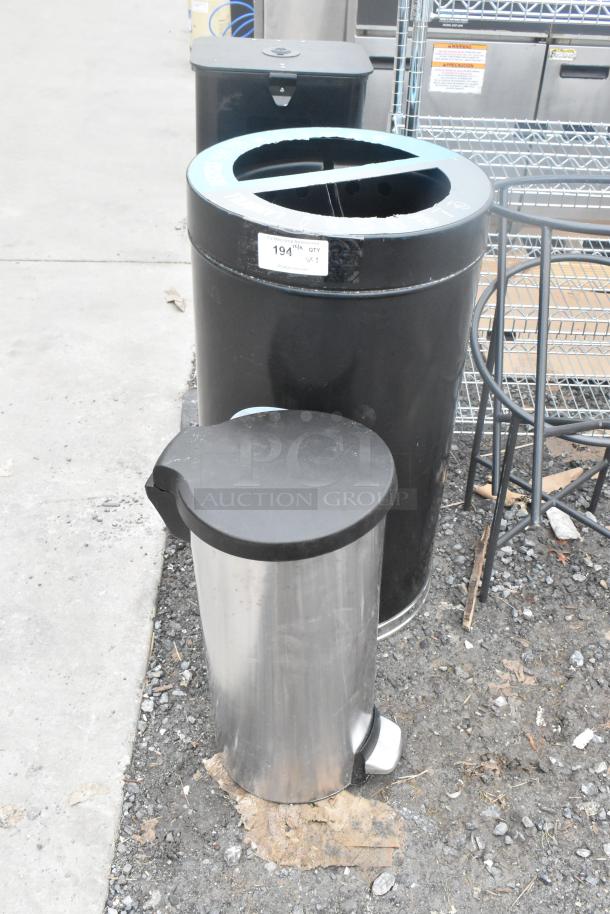 Three assorted trash cans, including a stainless steel pedal bin and two black bins. Label reads "194, QTY 3."