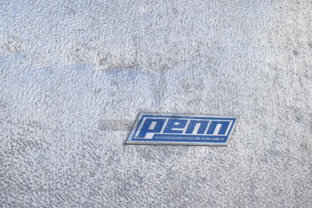 Two Penn walk-in boxes forming a combo box, no compressors or fans. Blue Penn label visible on textured surface.