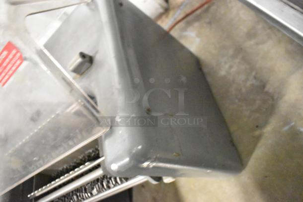 Metal commercial electric meat tenderizer, countertop model, 115 volts, 1 phase. Slightly scuffed, sturdy design.