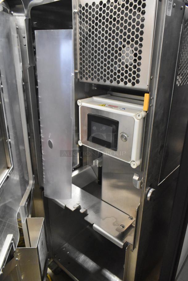 JBT 2ND-GEN-MFJ-HE stainless steel commercial citrus juicer, floor style, on casters, with digital control panel.