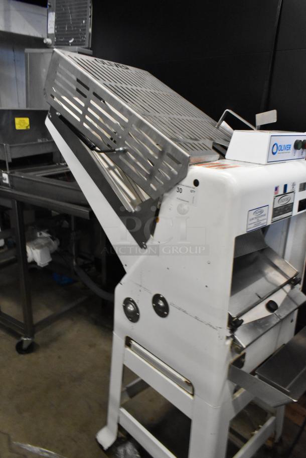 Oliver 797-32NC metal bread slicer, floor style, 115V, 1-phase, in good condition with labels and control panel visible.