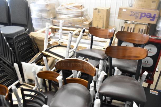 23 new scratch and dent chairs, including Lancaster Table & Seating 164CMTLADFR black metal ladder frame with wood back.