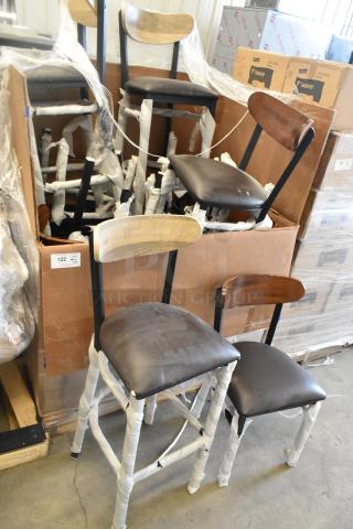 14 new black metal chairs with wooden backrests and cushioned seats in dining and bar height. Scratch and dent condition.