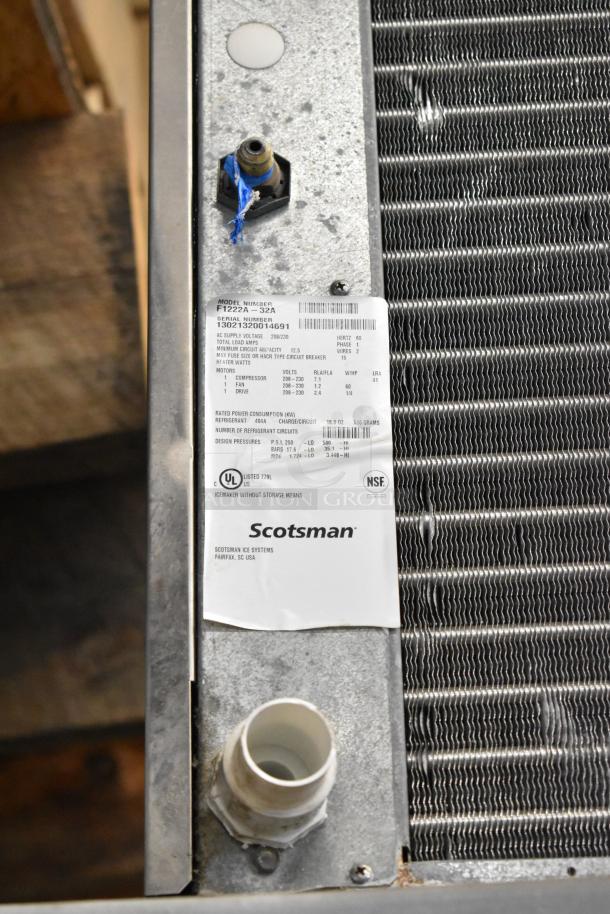 Scotsman F1222A-32A Prodigy ice head on Kloppenberg ICS-1 stainless steel bin. Visible label shows specs and brand logos.
