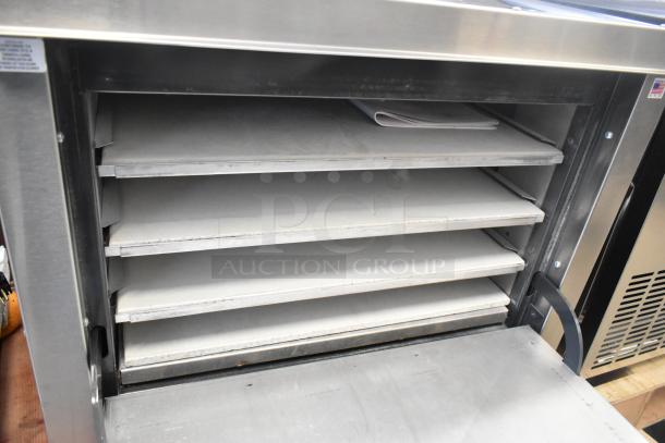 Brand new Peerless C131P stainless steel commercial natural gas pizza oven with 4 cooking stones, single door, 30,000 BTU.