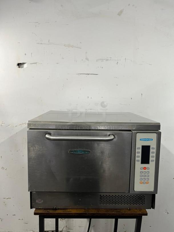 TurboChef NGC ventless high-speed oven, stainless steel, commercial-grade condition with front control panel and branded logo.