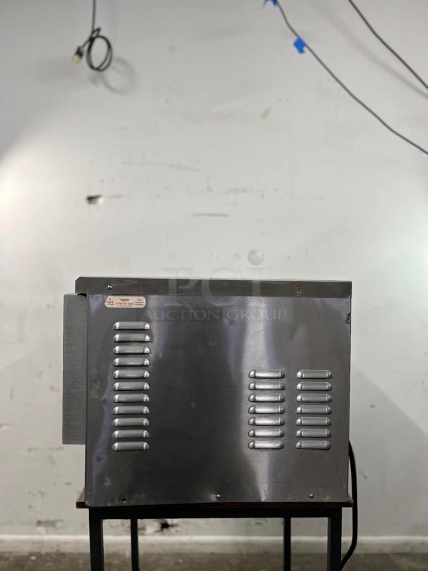 TurboChef NGC high-speed commercial oven, ventless design, brushed metal finish, visible vents, good condition.