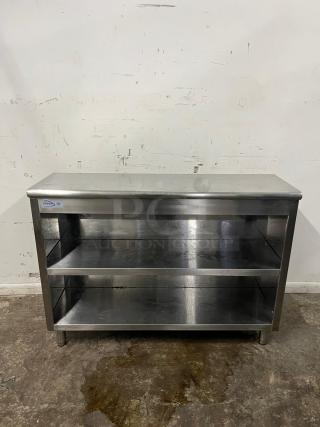 YUKON stainless steel cabinet with open front, two shelves, slight wear, visible manufacturer's label on the top left.