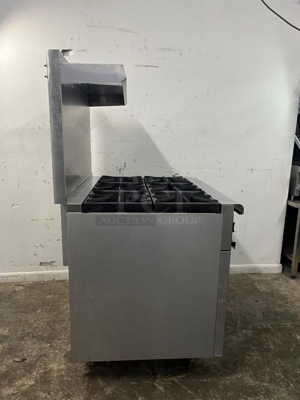 Brand new Omcan 43151 36-inch gas commercial range, 6 open burners, 211,000 BTU, stainless steel, side view.