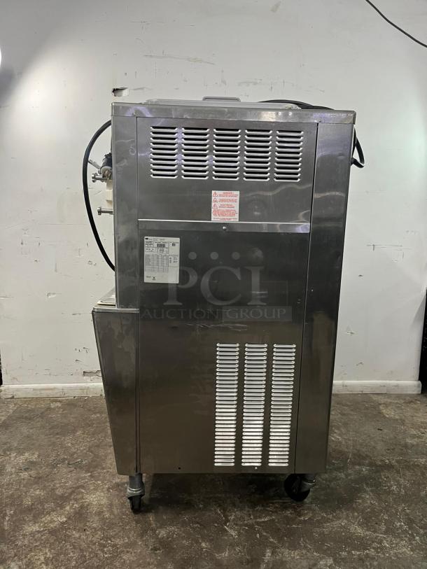 TAYLOR 794-33 soft serve ice cream machine, stainless steel, on wheels, visible model label, good condition.