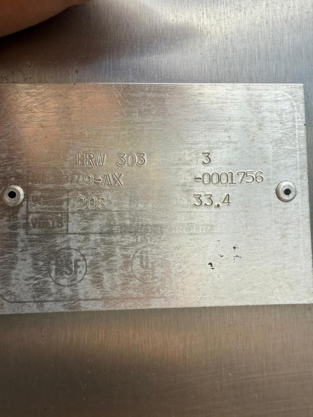 Metal plate on HOBART Electric Rotisserie Oven model HRW 303 showing engraved specifications and serial number.