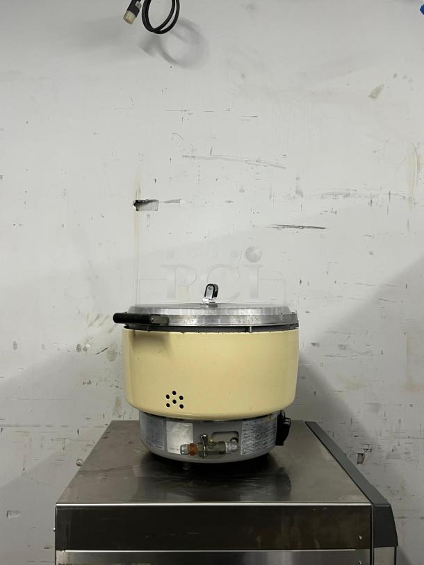Rinnai RER55ASN 55-cup commercial natural gas rice cooker, cream color, stainless steel lid, visible gas valve, used condition.