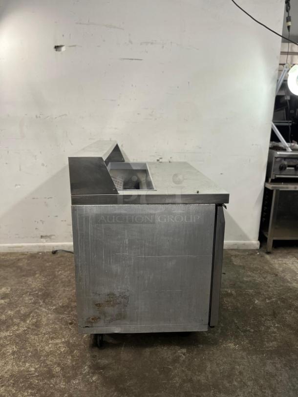 Continental SW48-12 refrigerated sandwich prep unit, 48-inch, 13.4 cu ft. Stainless steel, visible wear, on castors.