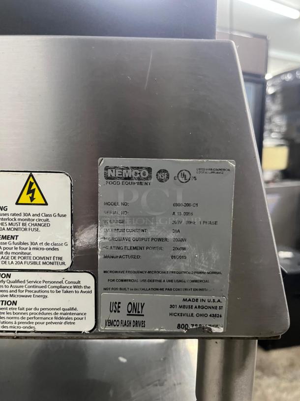 Nemco 6900-208 commercial panini press label shows model 6900-208-C1, 208V, 30A, manufactured January 2019, NSF certified.